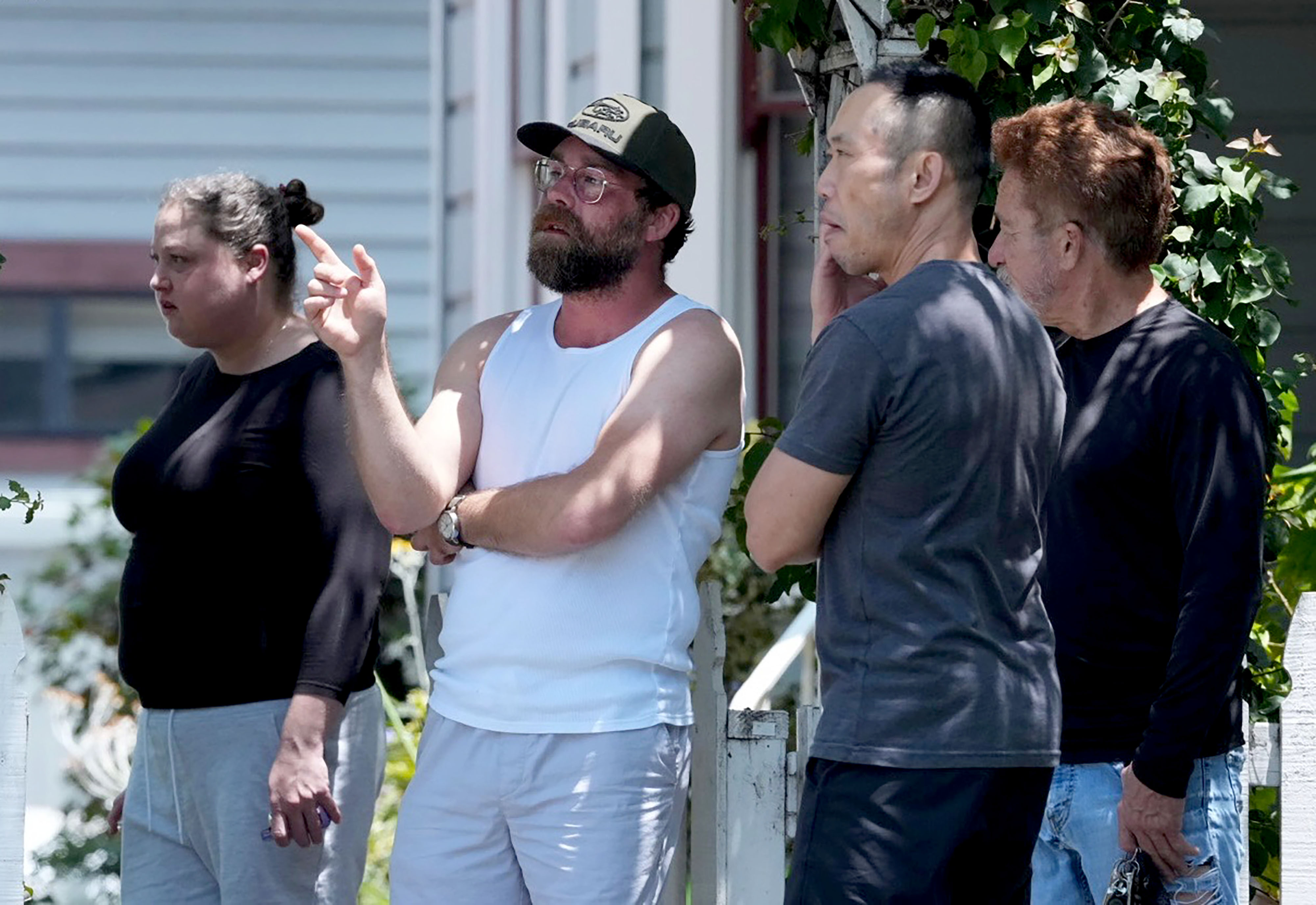 Residents near Del Mar Boulevard and Euclid Avenue watch as...