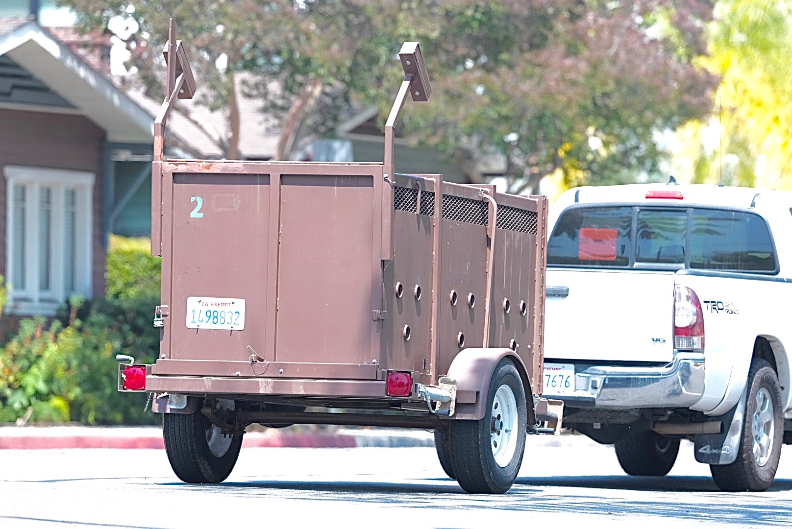A vehicle tows a trailer to the scene of a...