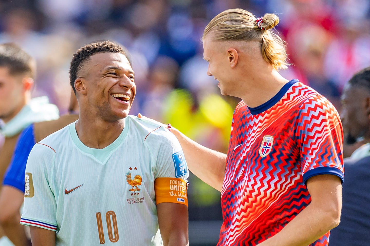 France's Kylian Mbappe (10) shares a laugh with Norway's Erling Haaland after their match Friday in Foxborough, but the pair of superstar strikers didn't face each other as Haaland sat out the group finale.