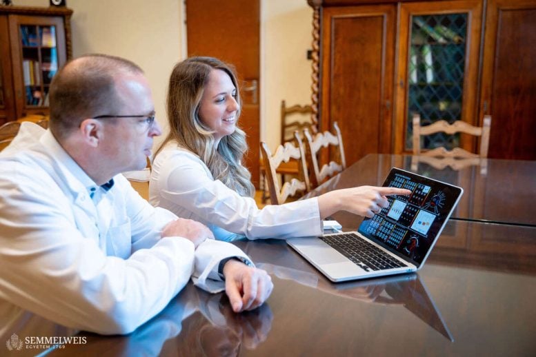 Rheumatoid Arthritis Depression Researchers Pointing at Laptop