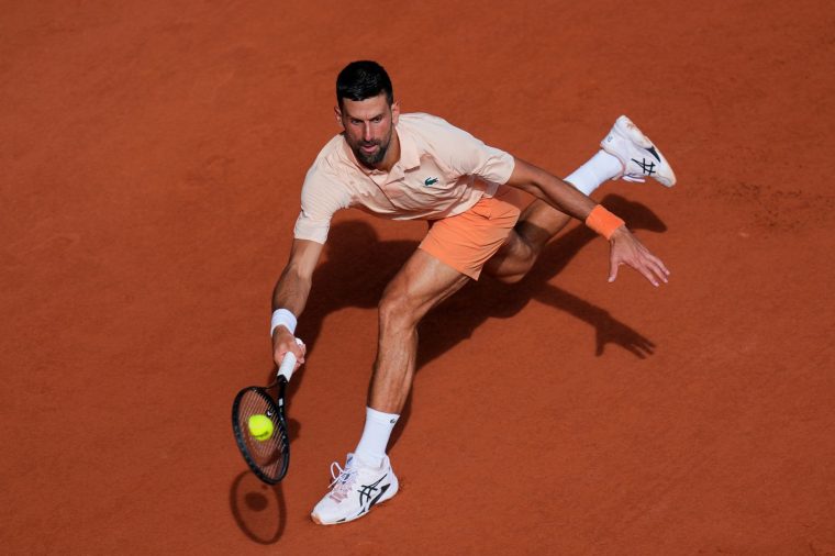 PARIS, FRANCE - MAY 29: Novak Djokovic of Serbia stretches for a forehand against Joao Fonseca of Brazil in the Men's Singles Third Round match on Day Six of the 2026 French Open at Roland Garros on May 29, 2026 in Paris, France. (Photo by Franco Arland/Getty Images)