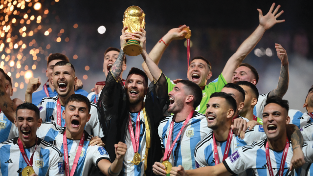 Argentina's Lionel Messi lifts the World Cup trophy following his team's victory against France in the final match of the Qatar 2022 World Cup on Dec. 18, 2022. (Franck Fife/AFP via Getty Images)