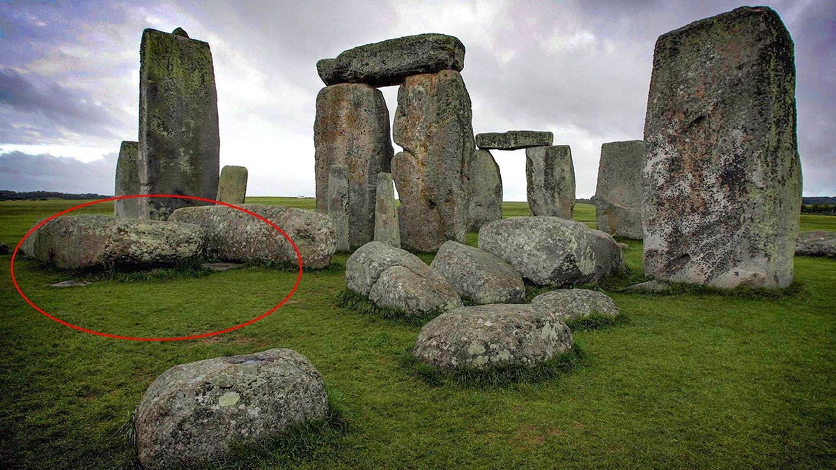 View of Altar Stone circled at Stonehenge monument