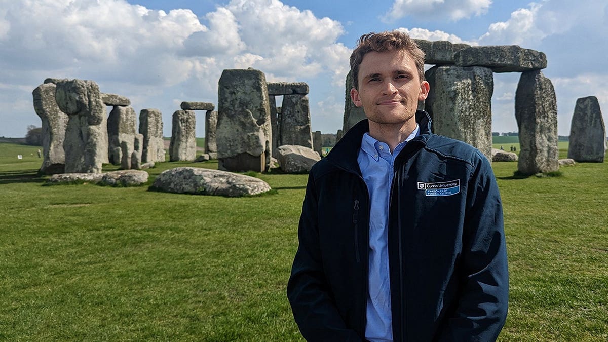 Anthony Clarke standing near Stonehenge