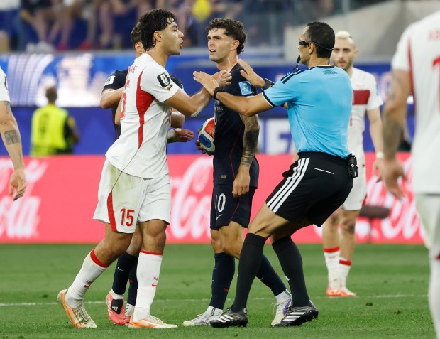Ozan Kabak #15 of Turkiye and Christian Pulisic #10 off the United States are separated during a FIFA World Cup 2026 match at Los Angeles Stadium on June 25, 2026 in Inglewood, California. (K.C. Alfred / The San Diego Union-Tribune)