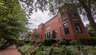 DC home with red brick and black rimmed windows