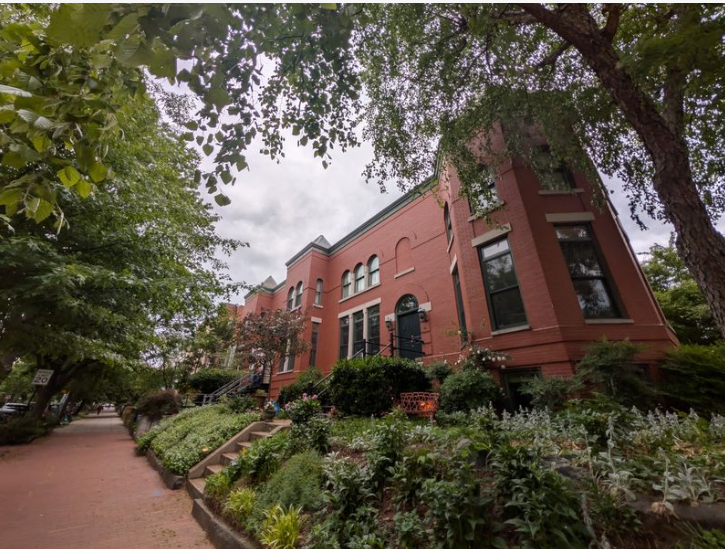 DC home with red brick and black rimmed windows