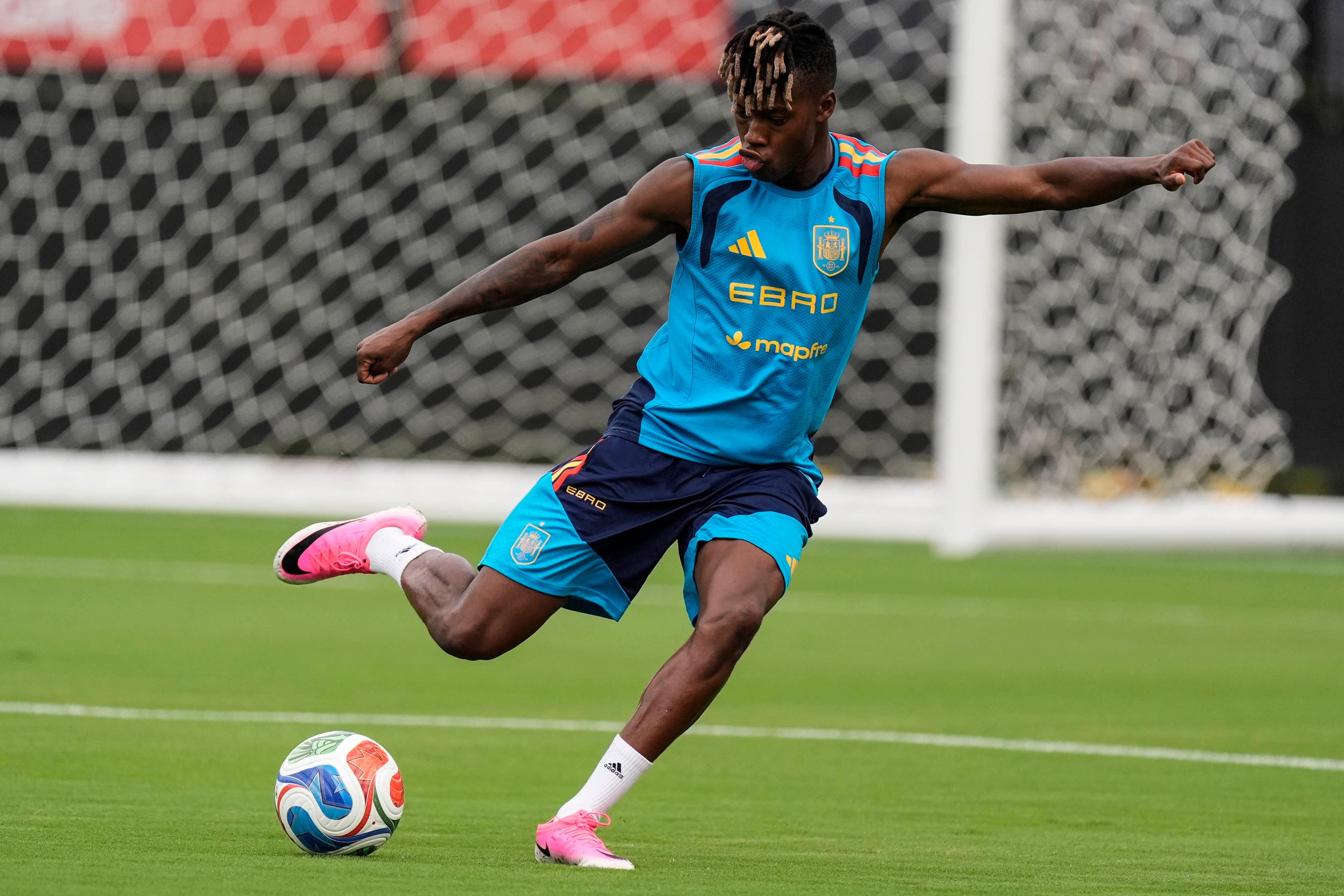Spain’s Nico Williams works out during a training session, Saturday,...