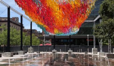 Colorful floating sculpture flying high over Denver Union Station