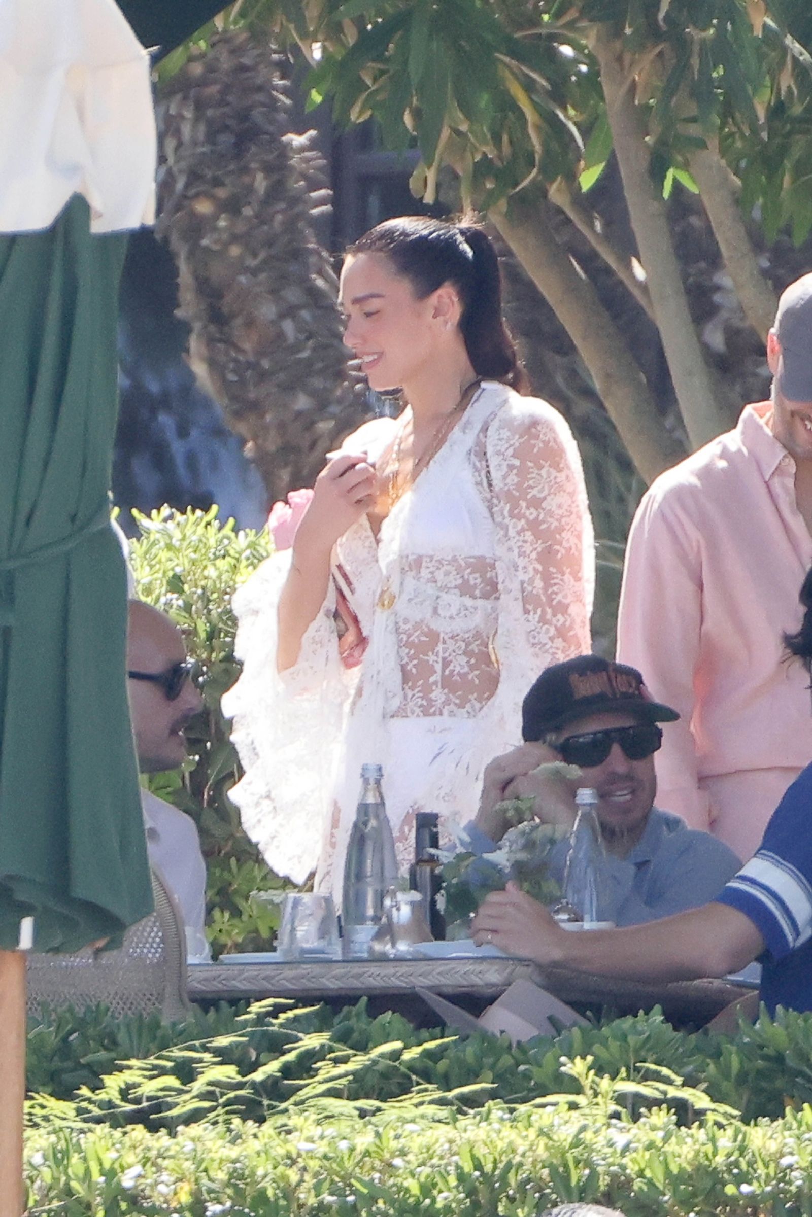Image may contain Andrew Watt Dua Lipa Plant Potted Plant Clothing Dress Face Head Person Photography and Portrait