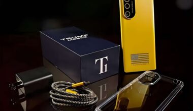 A yellow smartphone labeled 'Trump Mobile' is displayed alongside a charging cable, a plug, a clear phone case, and a branded box with a large 'T' logo.