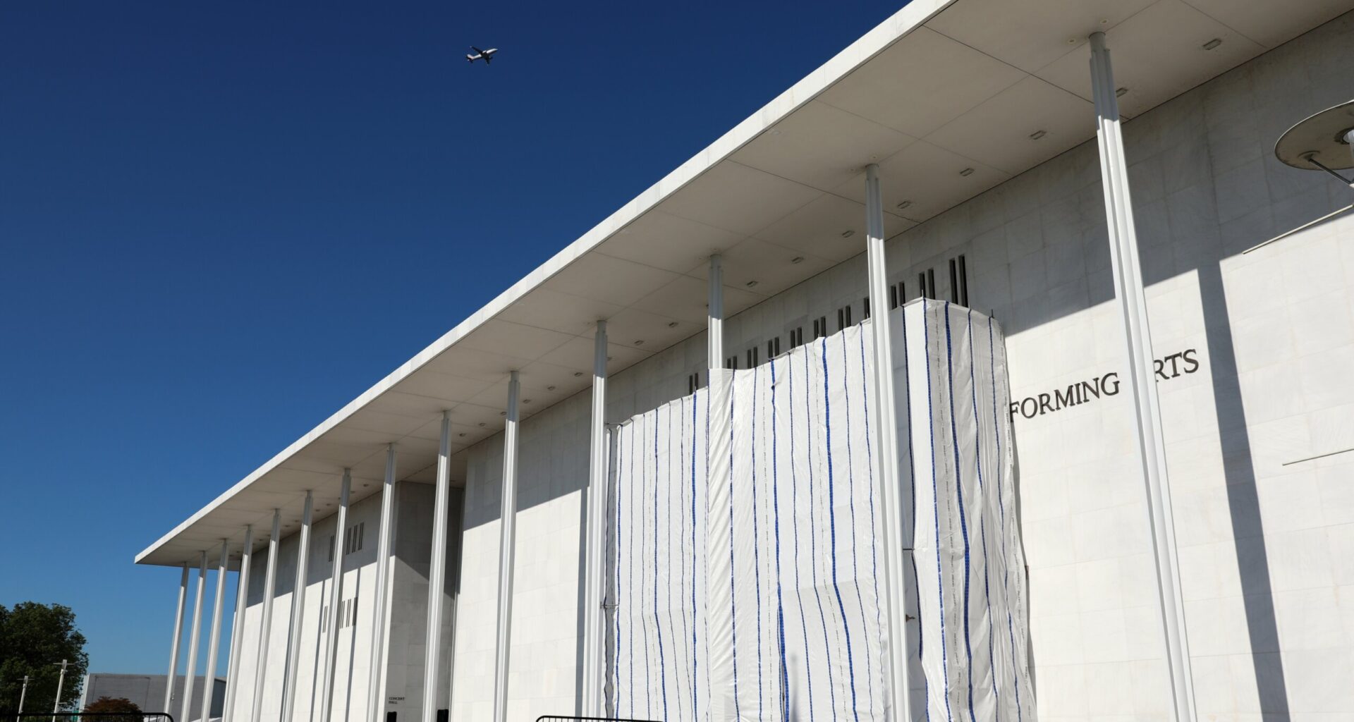 PHOTOS: What’s under the tarp? Kennedy Center facade covered after Trump’s name removed