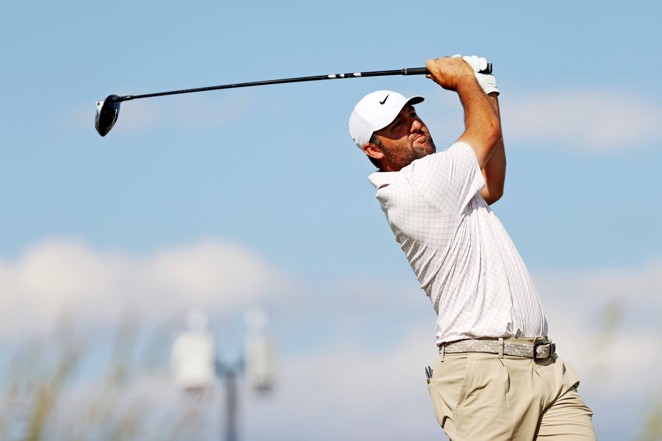 Scottie Scheffler watches his shot off the 13th tee.