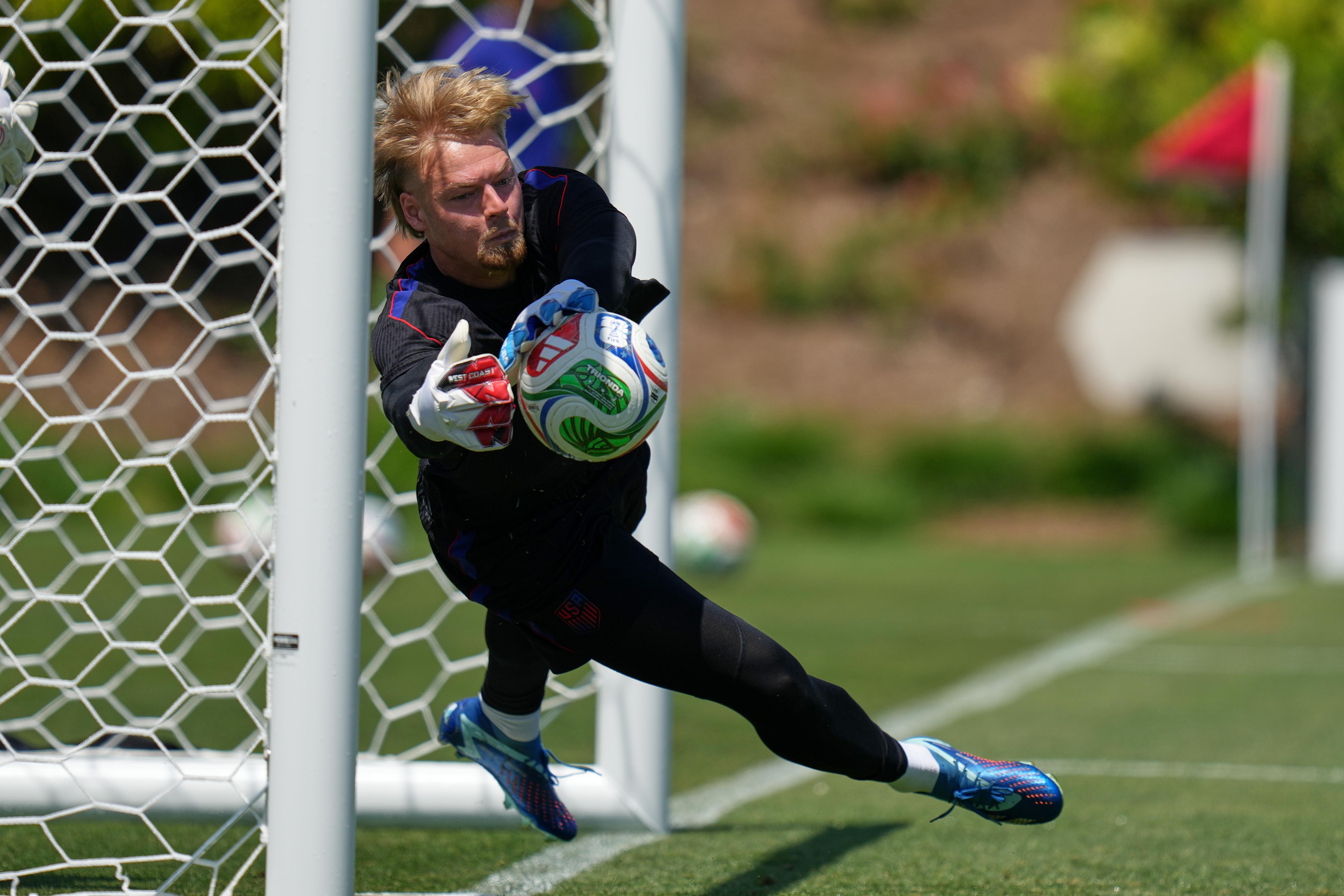 United States goalkeeper Chris Brady practices during a training session...