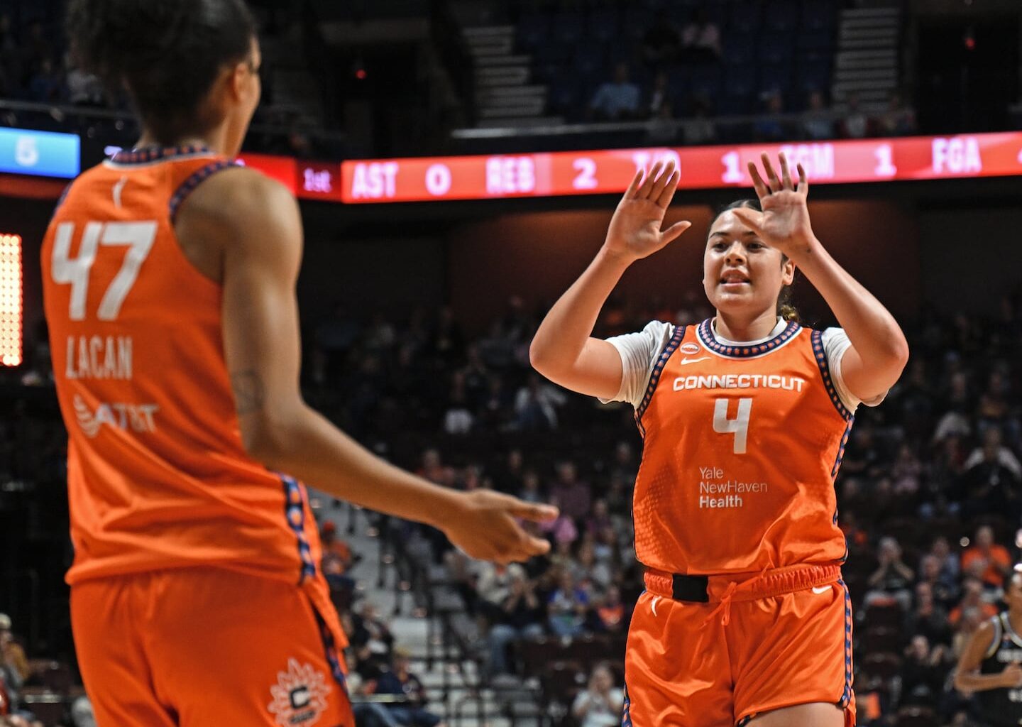 Charlisse Leger-Walker (right) had 10 points to help the Sun knock off the Mystics on Friday.