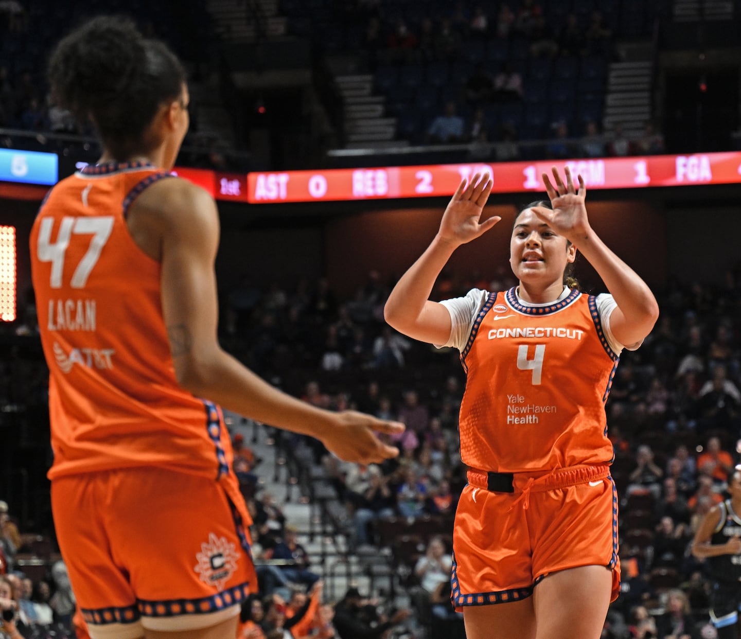 Charlisse Leger-Walker (right) had 10 points to help the Sun knock off the Mystics on Friday.