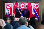 People watch a TV screen showing a file image of North Korean leader Kim Jong Un, right, and Chinese President Xi Jinping, at the Seoul Railway Station in Seoul, South Korea, Friday, June 5, 2026.