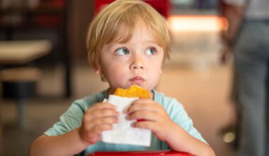 Young Child Eating Fast Food
