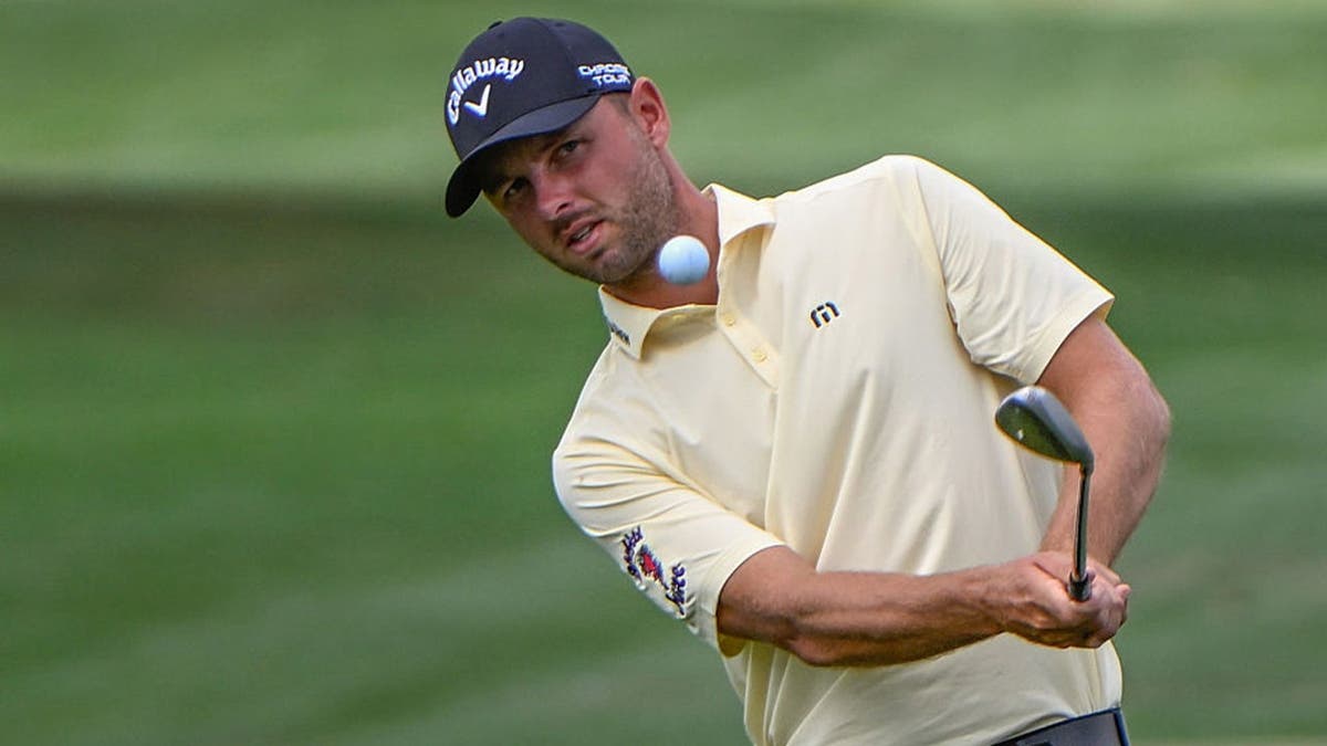 Adam Svensson (CAN) chips on to 18