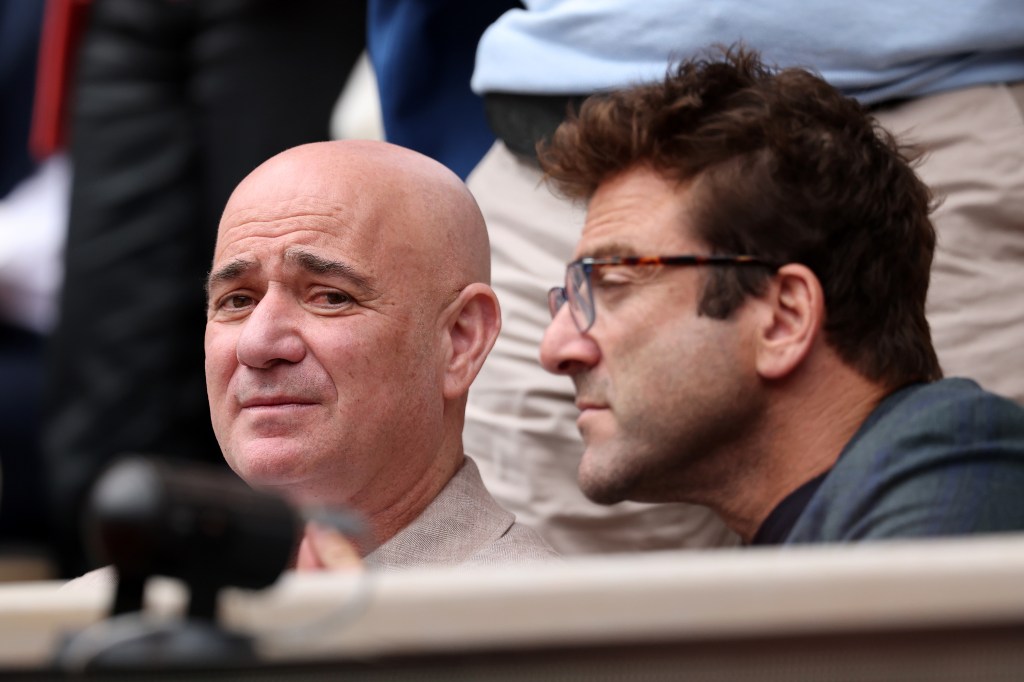 Andre Agassi watching a tennis match at the French Open.
