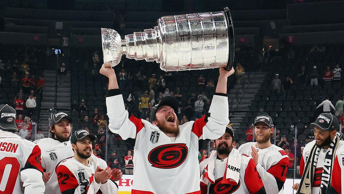 Andrei Svechnikov holding the Stanley Cup at T-Mobile Arena in Las Vegas