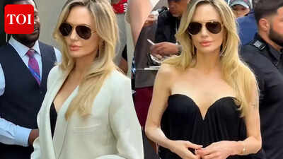 Angelina Jolie makes jaws drop at 'Couture' screening in New York; Actress shows off tattooed back in strapless gown - WATCH