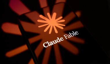 The Claude Fable logo is displayed on the screen of a smartphone placed on a reflective surface onto which the company's icon is projected.