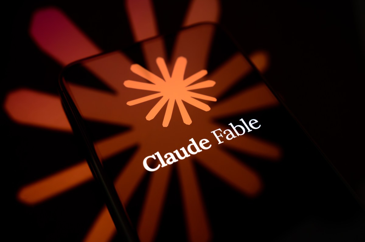 The Claude Fable logo is displayed on the screen of a smartphone placed on a reflective surface onto which the company's icon is projected.