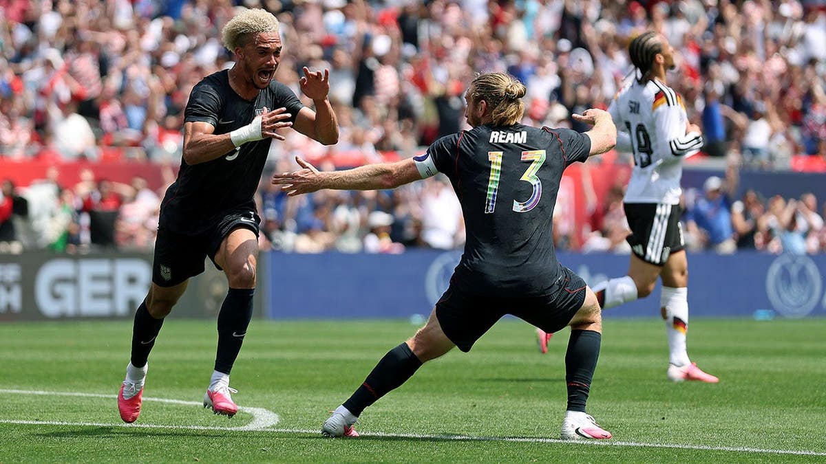 Antonee Robinson celebrating after scoring a goal at Soldier Field in Chicago