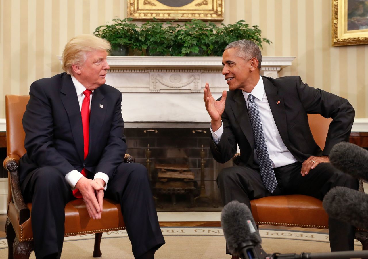 In this file image from 2016, President Barack Obama, right, meets with then President-elect Donald Trump in the Oval Office of the White House in Washington, DC.