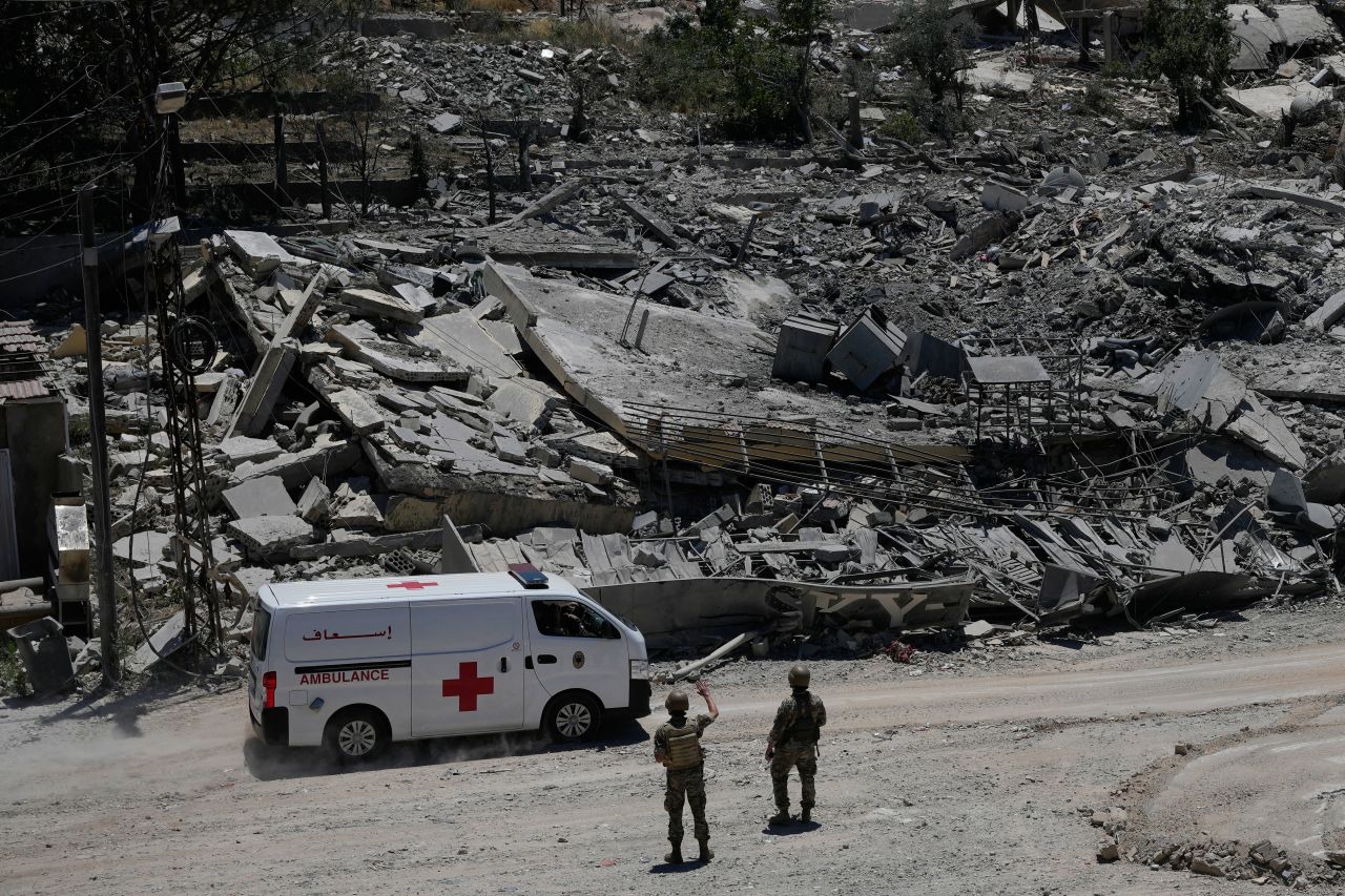 Lebanese soldiers at a road in front of destroyed houses in Dibbine village, southeast Lebanon, on Friday, June 5, 2026,.