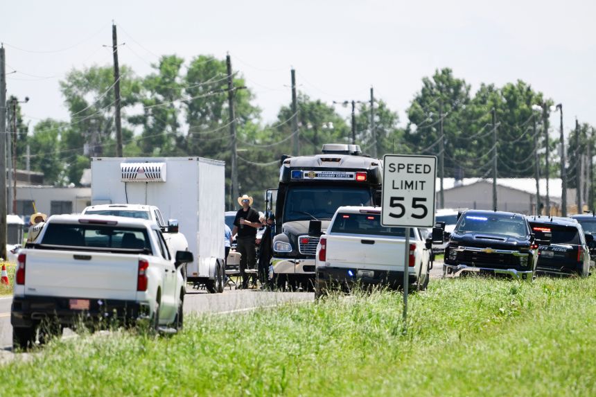 Emergency vehicles parked outside the Butler Memorial Airport after a plane crash June 14.