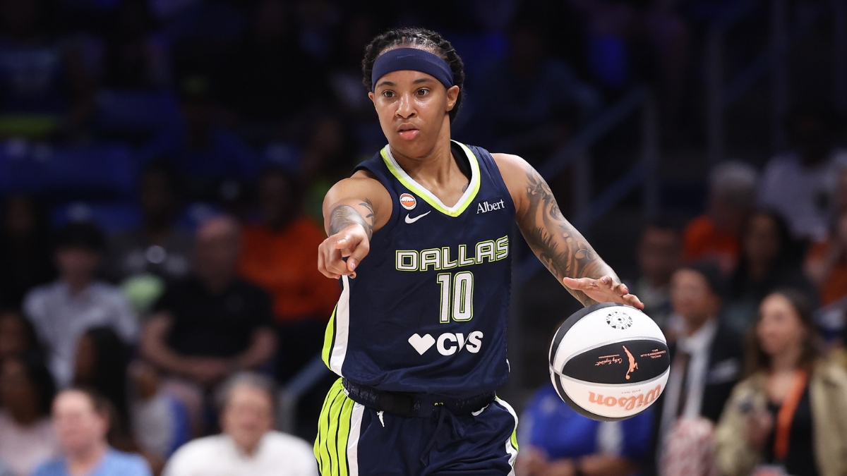 Dallas Wings guard Aziaha James controls the ball against the Seattle Storm