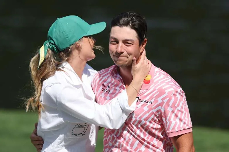 AUGUSTA, GEORGIA - APRIL 08: Viktor Hovland of Norway hugs Tuva Jensen on the ninth green during the Par Three Contest prior to the 2026 Masters Tournament at Augusta National Golf Club on April 08, 2026 in Augusta, Georgia. (Photo by Hector Vivas/Getty Images)