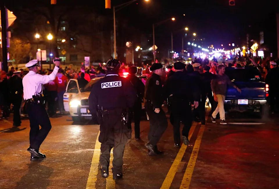 Jan 12, 2015; Columbus, OH, USA; Columbus Police walk the streets as Ohio State Buckeyes fans celebrate after the victory over the Oregon Ducks in the 2015 College Football Playoff National Championship game. Mandatory Credit: Aaron Doster-USA TODAY Sports