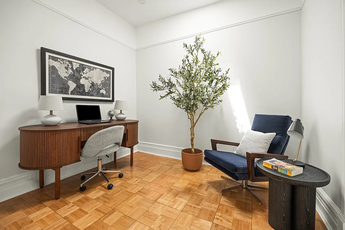 bedroom with white walls, picture rails