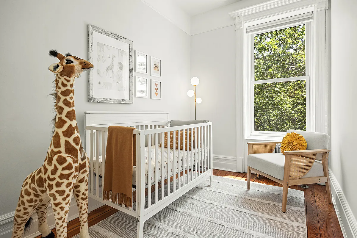 bedroom set up as a nursery with a crib