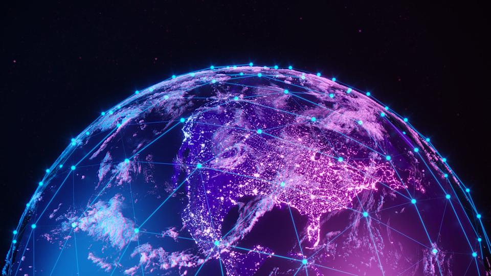 Digital globe with glowing network connections and illuminated cities.