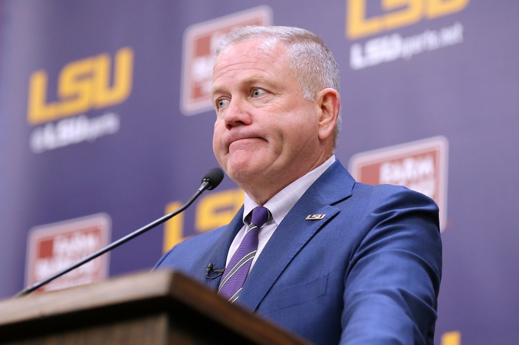 Brian Kelly speaking at a press conference as head football coach of the LSU Tigers.