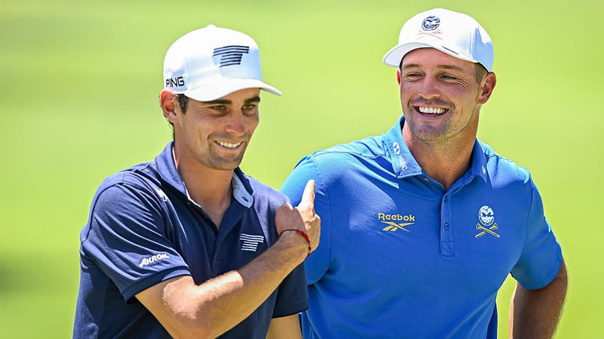 Joaquin Niemann talks with Bryson DeChambeau