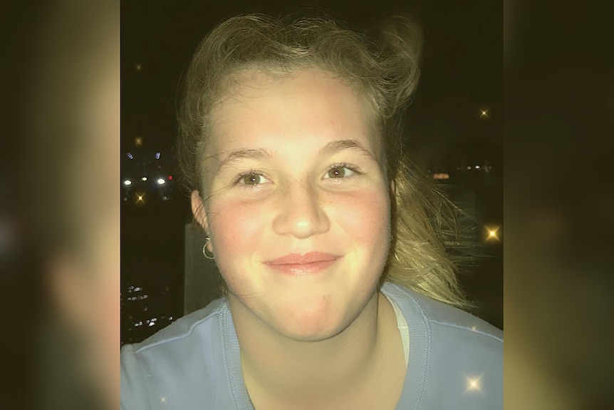 A young girl poses for a close up photo