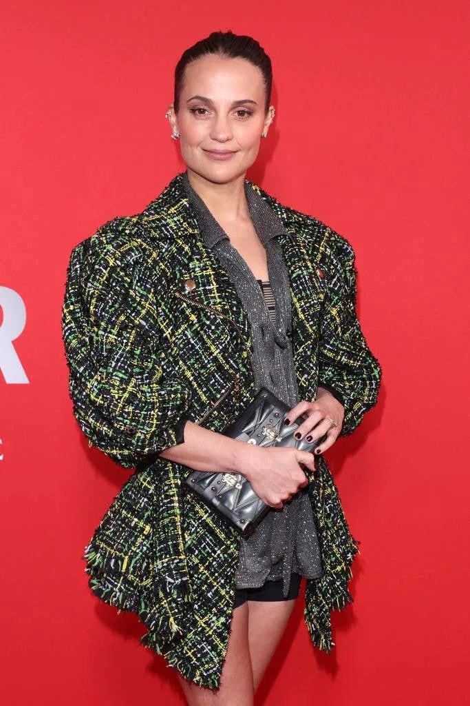 Alicia Vikander in a green outfit
