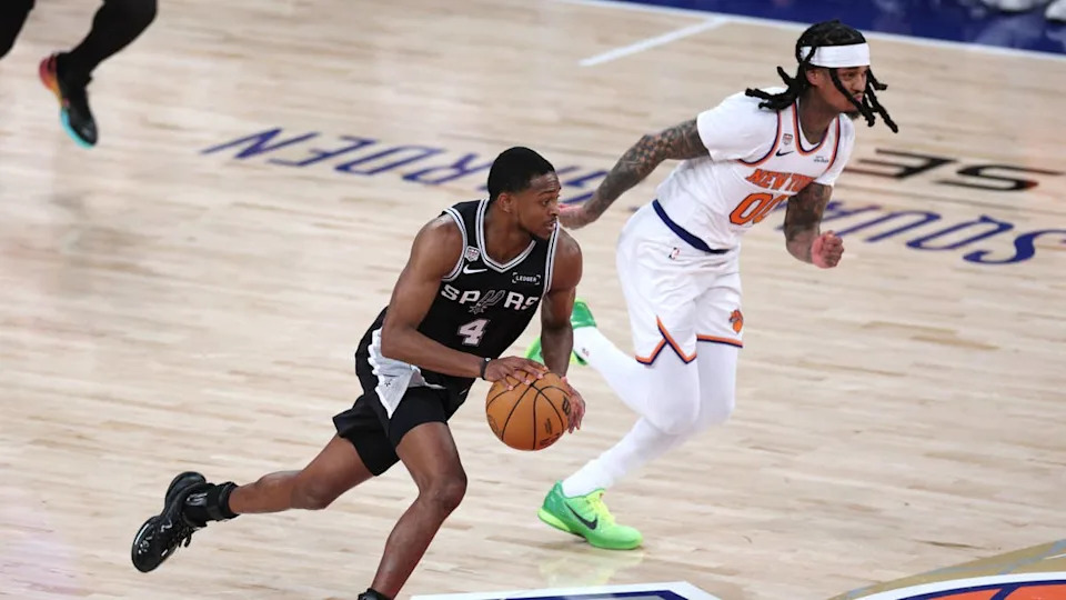 Jun 8, 2026; New York, New York, USA; San Antonio Spurs guard De'aaron Fox (4) controls the ball against New York Knicks guard Jordan Clarkson (00) in the fourth quarter during game three of the 2026 NBA Finals at Madison Square Garden. Mandatory Credit: Vincent Carchietta-Imagn Images© Vincent Carchietta-Imagn Images.