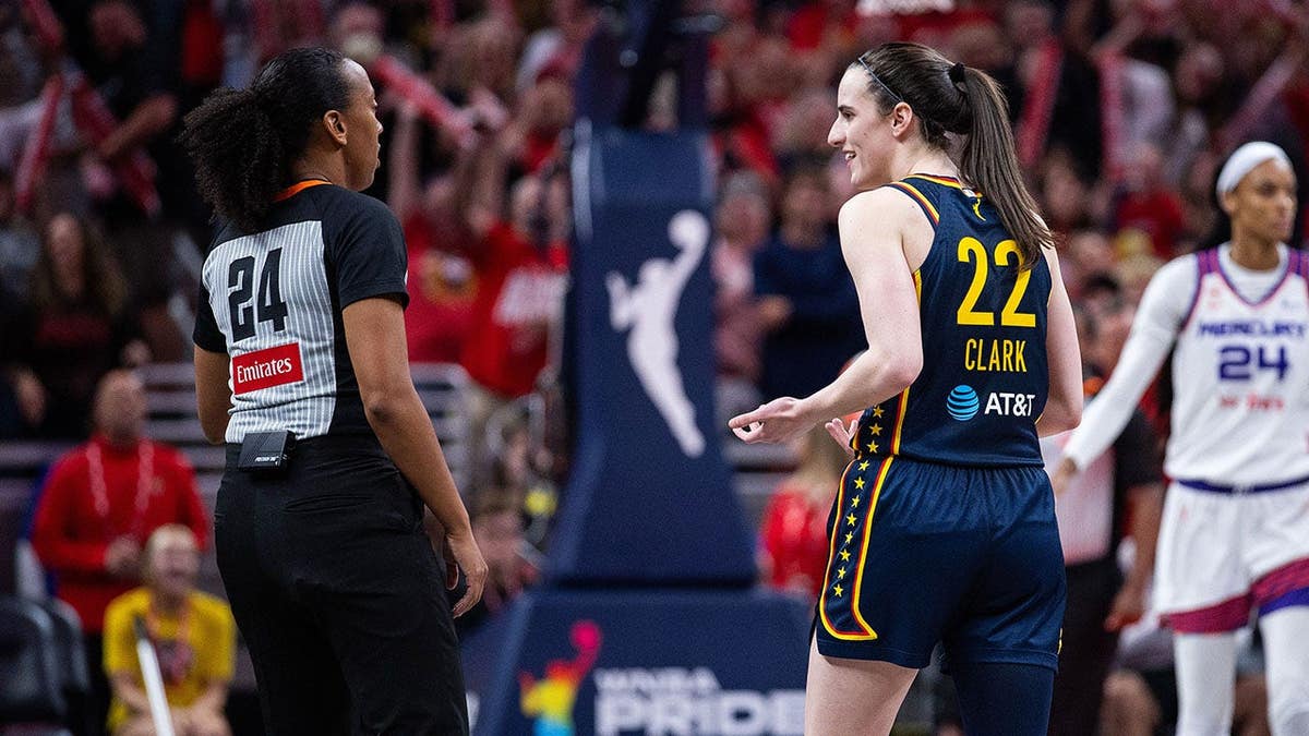 Indiana Fever guard Caitlin Clark asking about a technical foul during a game at Gainbridge Fieldhouse.