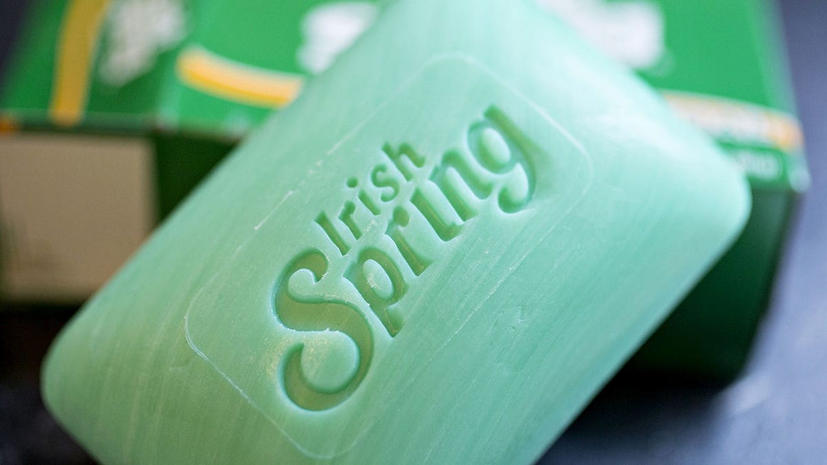 A bar of Colgate-Palmolive Co. Irish Spring brand soap on a white surface.