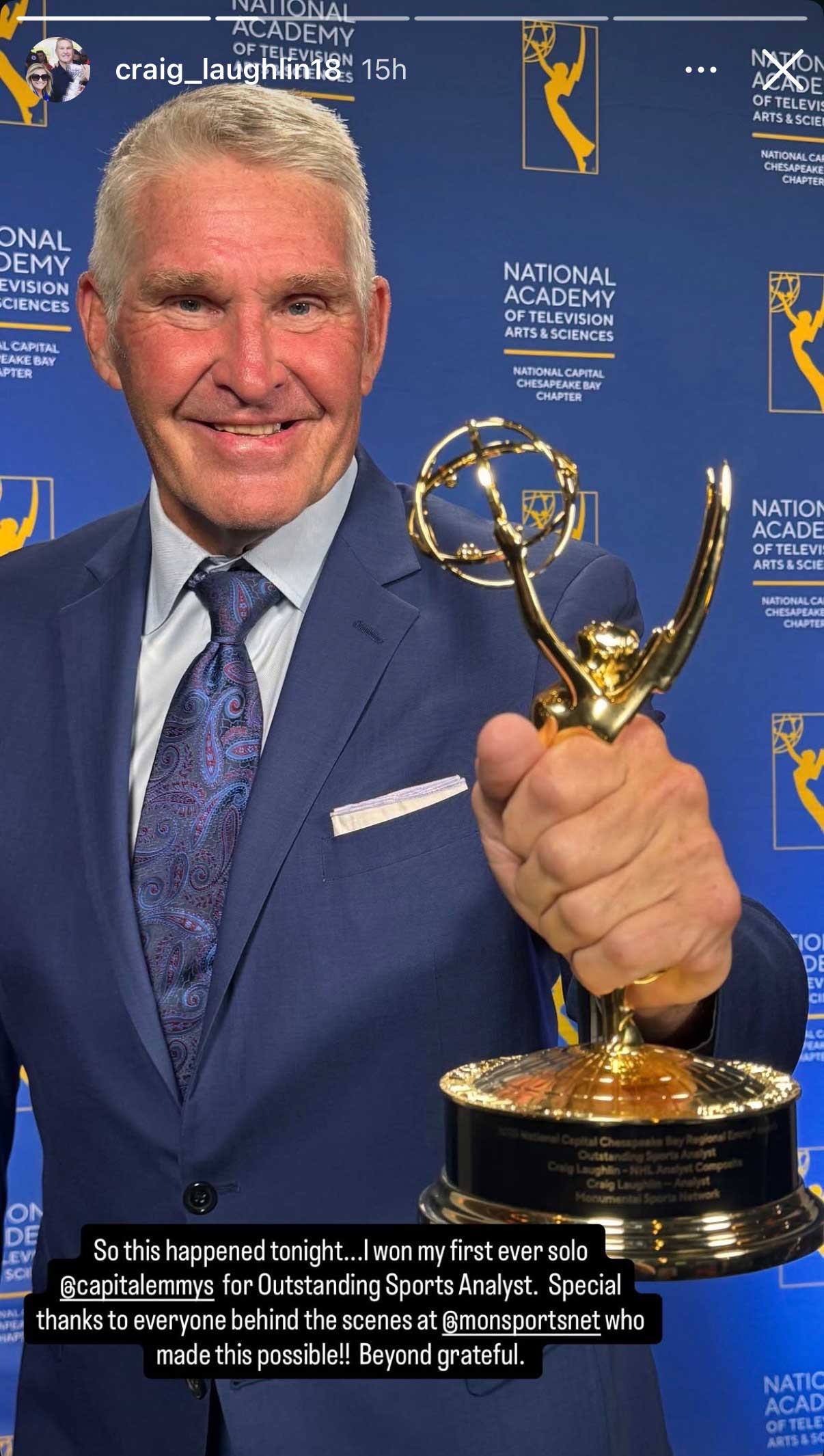 Craig Laughlin holds up an Emmy 