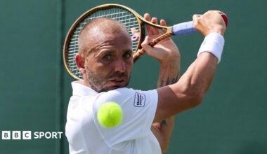 Dan Evans hits a backhand