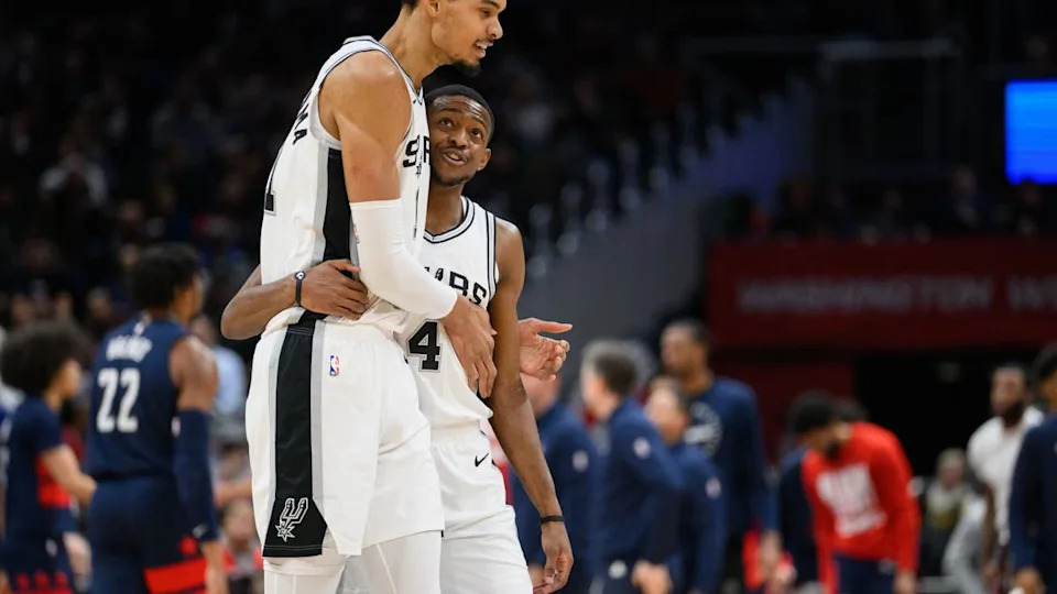 San Antonio Spurs center <a class="link " href="https://sports.yahoo.com/nba/players/10094/" data-i13n="sec:content-canvas;subsec:anchor_text;elm:context_link" data-ylk="slk:Victor Wembanyama;sec:content-canvas;subsec:anchor_text;elm:context_link;itc:0" data-yga="{"yLinkElement":"context_link","yModuleName":"content-canvas","yLinkText":"Victor Wembanyama","ySubModuleName":"anchor_text","yHasCommerce":false}">Victor Wembanyama</a> (1) and guard De'Aaron Fox (4) react during the second quarter against the <a class="link " href="https://sports.yahoo.com/nba/teams/washington/" data-i13n="sec:content-canvas;subsec:anchor_text;elm:context_link" data-ylk="slk:Washington Wizards;sec:content-canvas;subsec:anchor_text;elm:context_link;itc:0" data-yga="{"yLinkElement":"context_link","yModuleName":"content-canvas","yLinkText":"Washington Wizards","ySubModuleName":"anchor_text","yHasCommerce":false}">Washington Wizards</a> at Capital One Arena.© Reggie Hildred-Imagn Images