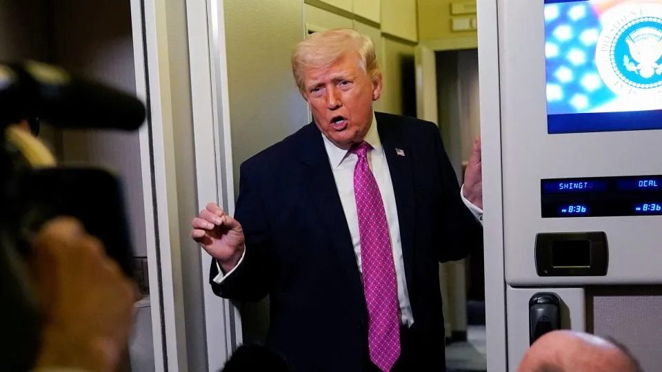 President Donald Trump talks to members of the media aboard Air Force One en route to Joint Base Andrews, Maryland, on March 29. - Elizabeth Frantz/Reuters