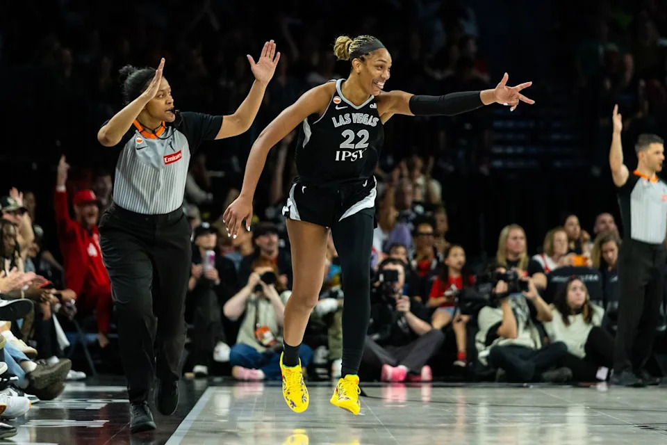 Las Vegas Aces forward A’ja Wilson (22) holds up three fingers as a celebration after scoring a three-point basket during a WNBA game between the Las Vegas Aces and the Seattle Storm, Monday June 8, 2026 in Las Vegas, Nev.